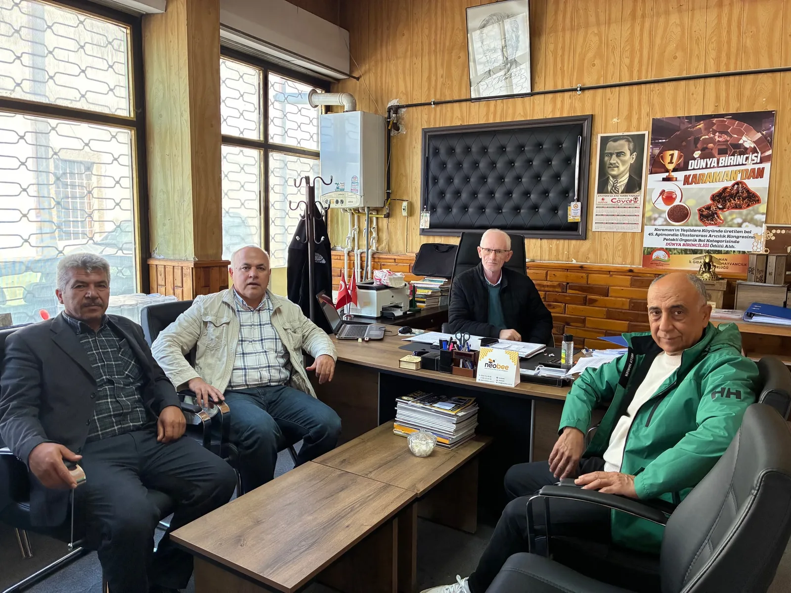 Four participants at the BeeBridge dissemination meeting in the Karaman Provincial Beekeepers' Union office