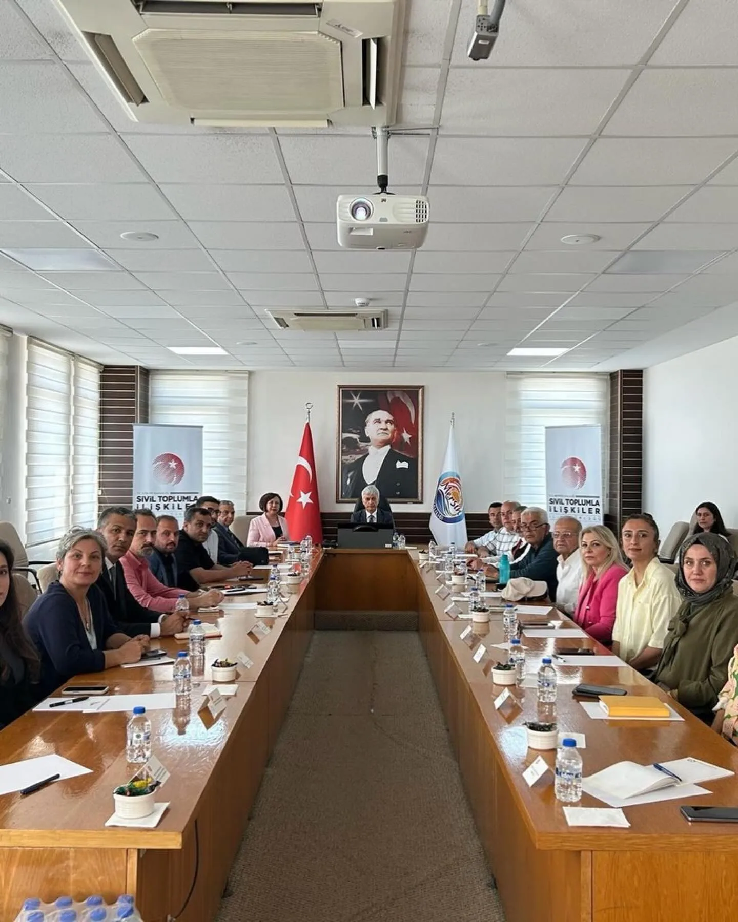 Participants gathered around the meeting table at the PRODES workshop in Mersin